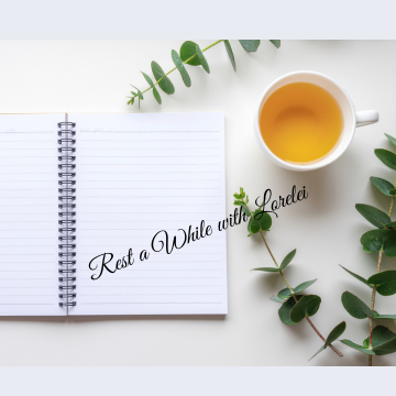 table-tea-journal | Comfort In The Chaos A calm tabletop scene with a notebook, a cup of tea, and greenery, overlaid with the words “Rest a While with Lorelei” in soft script lettering.